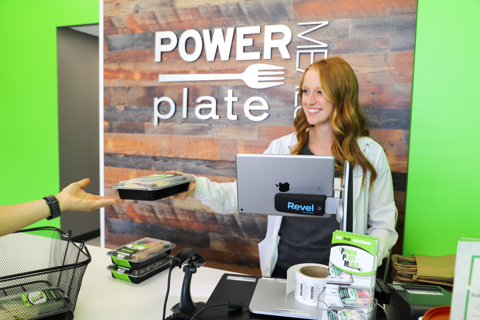 Power Plate Meals employee helping customer